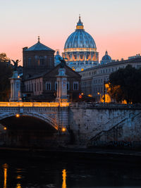 Illuminated buildings against sky during sunset in city, rome 