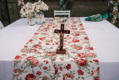 Crucifix on table runner