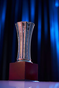 Close-up of table against blue background