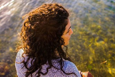 Close-up of woman over sea