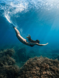 Woman swimming in sea