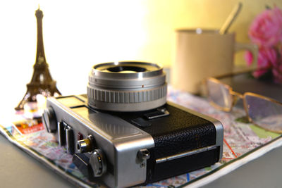 Close-up of camera on table at home