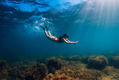 Full length of woman swimming in sea