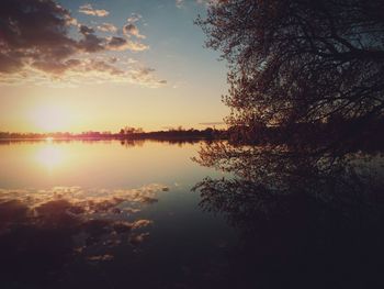 Scenic view of lake at sunset