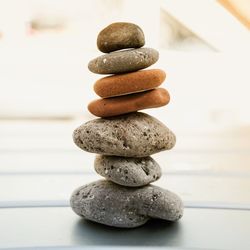 Stack of pebbles on table