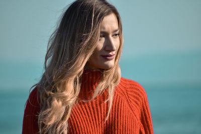 Portrait of a young woman looking away