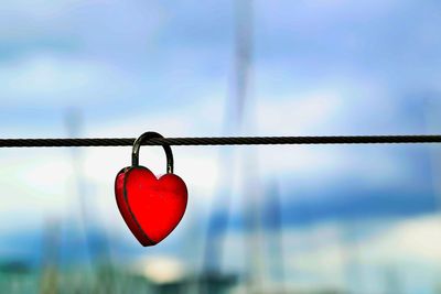 Close-up of padlocks on heart shape metal