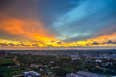 High angle view of buildings against sky during sunset
