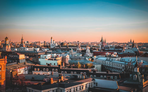 High angle view of buildings against sky during sunset