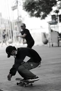 Young man  skating on the street in the city