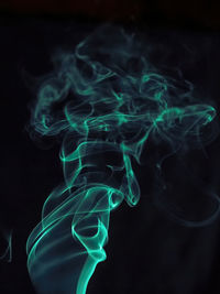 Close-up of smoke against black background