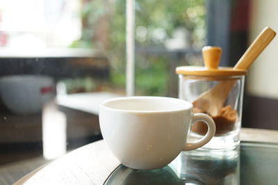 Close-up of coffee cup on table