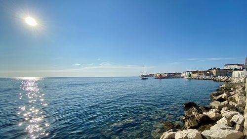 Scenic view of sea against blue sky
