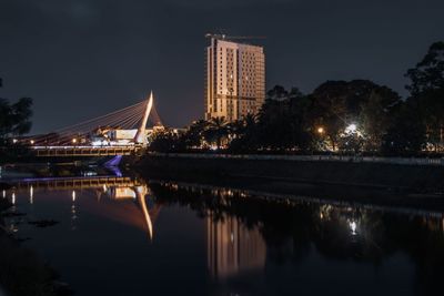 Reflection of illuminated buildings in water at night