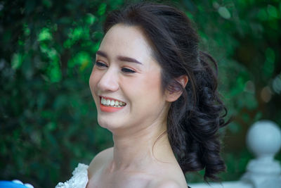 Close-up of young woman sitting outdoors