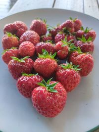 High angle view of strawberries in bowl on table