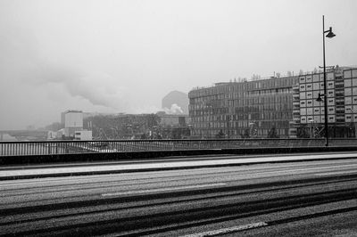 View of city buildings against clear sky