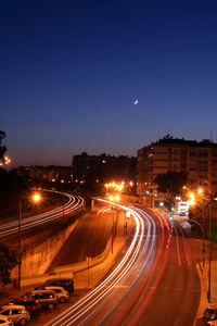 High angle view of light trails on city street