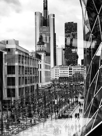 Buildings in city against sky