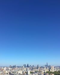 Cityscape against blue sky