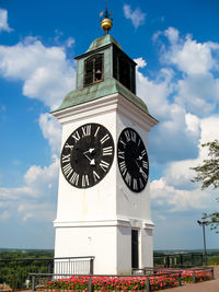 Low angle view of clock tower against sky