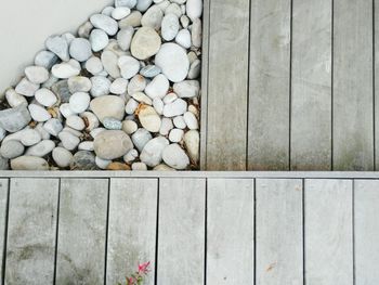 High angle view of rocks and wooden boardwalk