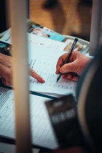 Midsection of businessman working on table