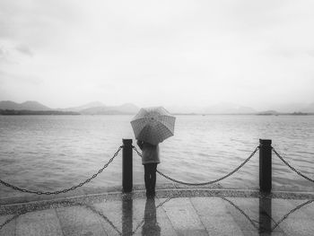 Man standing on pier