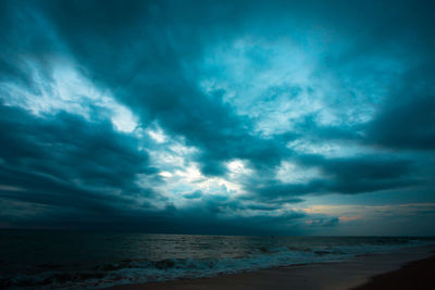 Scenic view of sea against dramatic sky