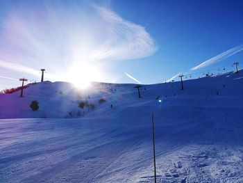 View of ski lift on snow covered mountain