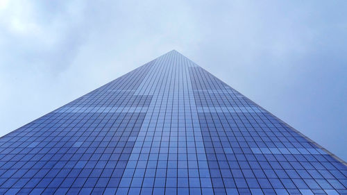 Low angle view of one world trade center against sky in city