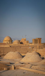 Buildings against clear sky