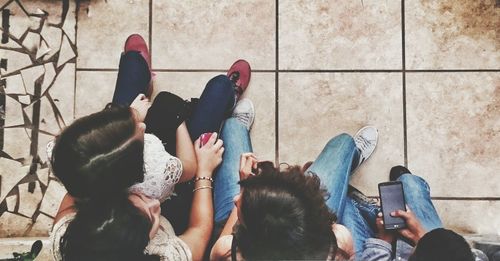 High angle view of group of friends sitting together