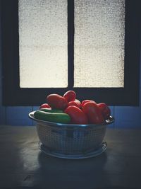 Close-up of apples in basket on table