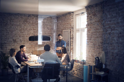 Business colleagues having discussion in conference room