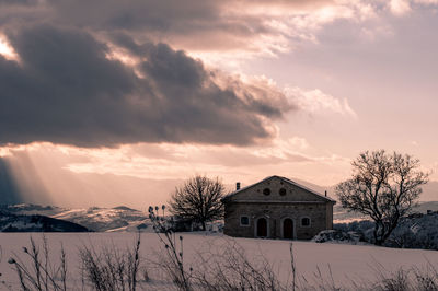 House against sky during winter