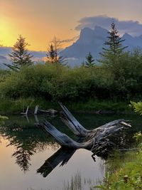 Scenic view of lake against sky during sunset