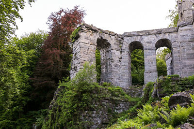 Low angle view of old ruins against sky