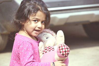 Portrait of cute girl with toy