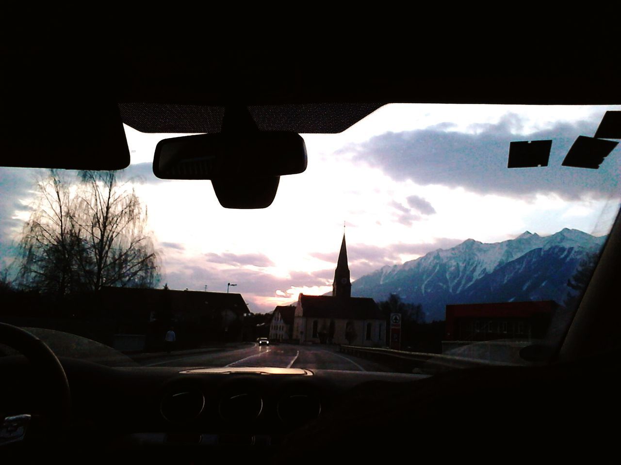 CARS ON SILHOUETTE OF CAR AGAINST SKY