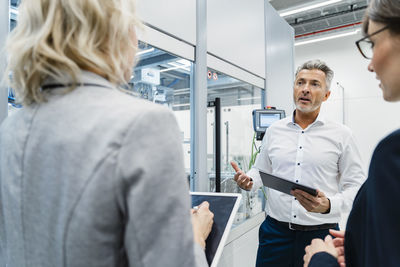 Businessman working with colleagues in electrical industry