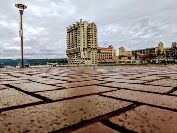 View of buildings against cloudy sky