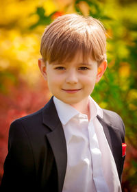 Portrait of boy standing outdoors