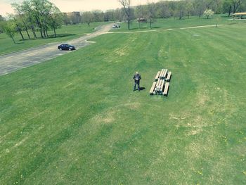 People on grassy field