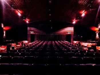 Empty chairs in illuminated room