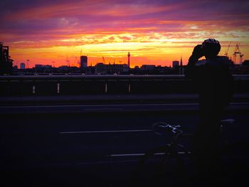 Silhouette of woman at sunset