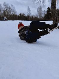 Man skiing on snow covered field