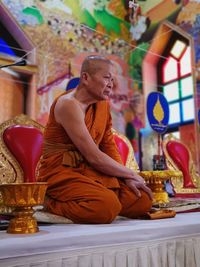 Monk sitting in temple