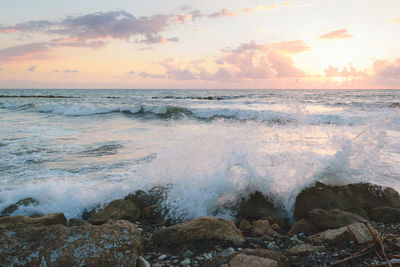 Scenic view of sea against sky during sunset