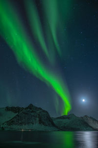 Scenic view of mountains against sky at night